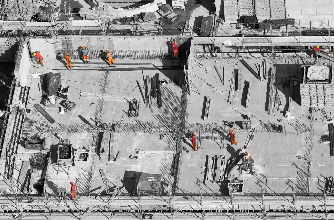 Workers on a site seen from above, each with a label box
