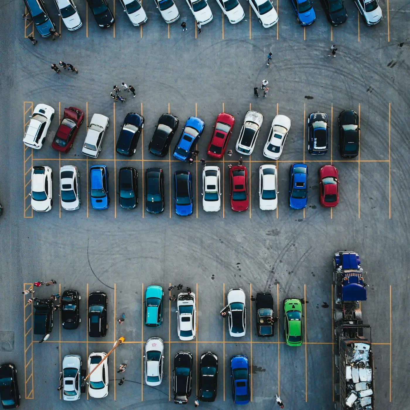 A car park seen from above with a label box around each vehicle and person