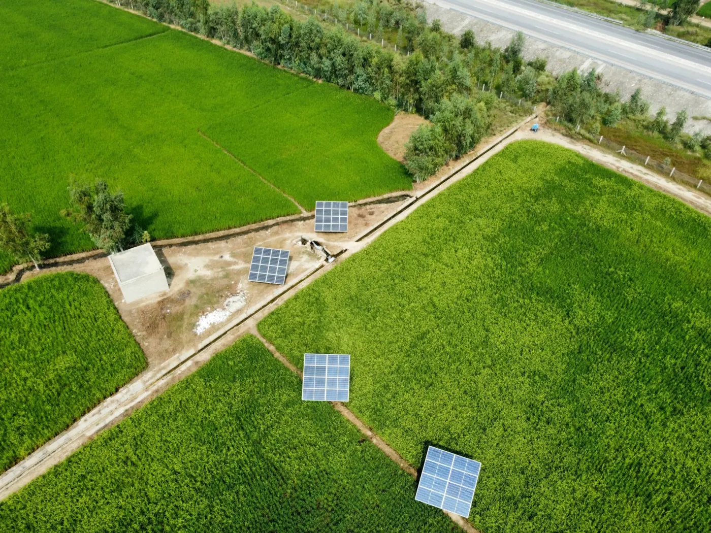 A solar farm seen from a drone, with label boxes around blocks of panels